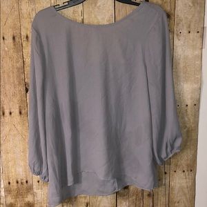 grey dressy top with bow back size M